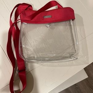 Clear cross body purse with red accent. Used a couple times.